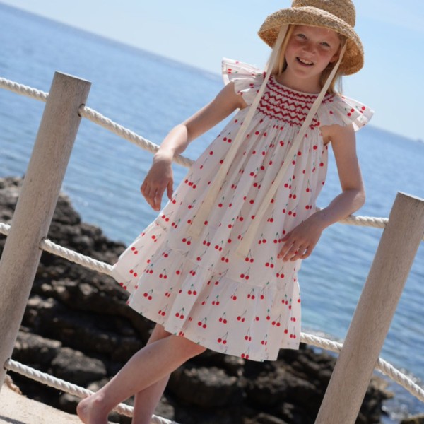 Indira Gandhi Flutter Dress Mon Cherry Cotton with a La Mode Hand Smocking Indira Gandhi Flutter Dress Mon Cherry Cotton with a La Mode Hand Smocking