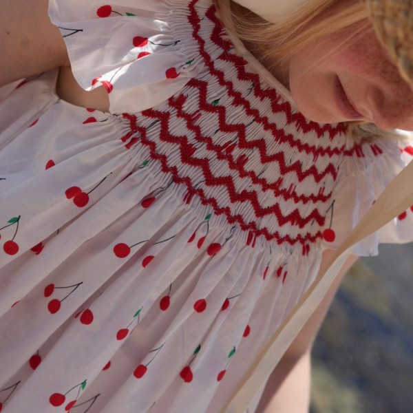 Indira Gandhi Flutter Dress Mon Cherry Cotton with a La Mode Hand Smocking Indira Gandhi Flutter Dress Mon Cherry Cotton with a La Mode Hand Smocking